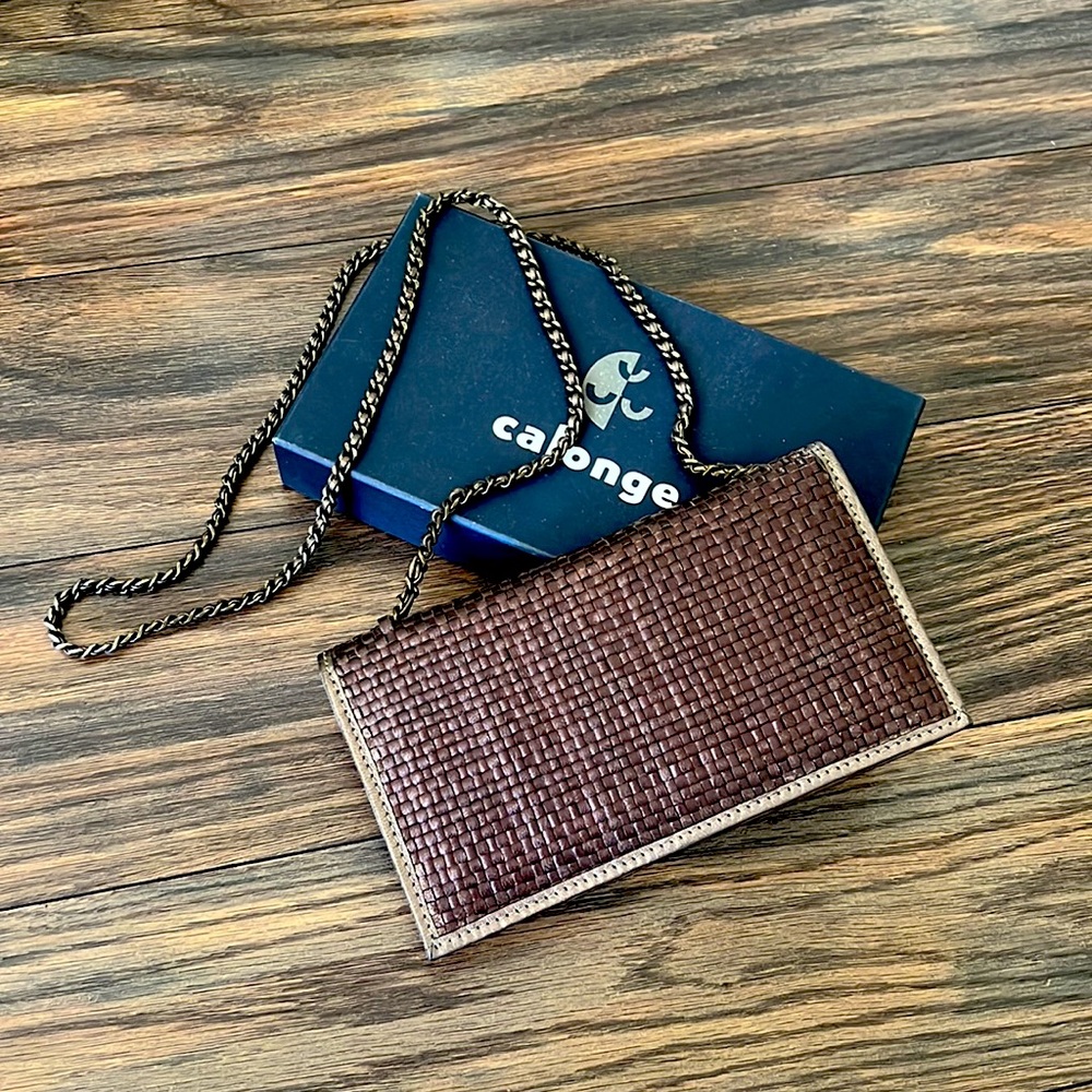 On-trend woven chocolate brown clutch and strap bag in original packaging